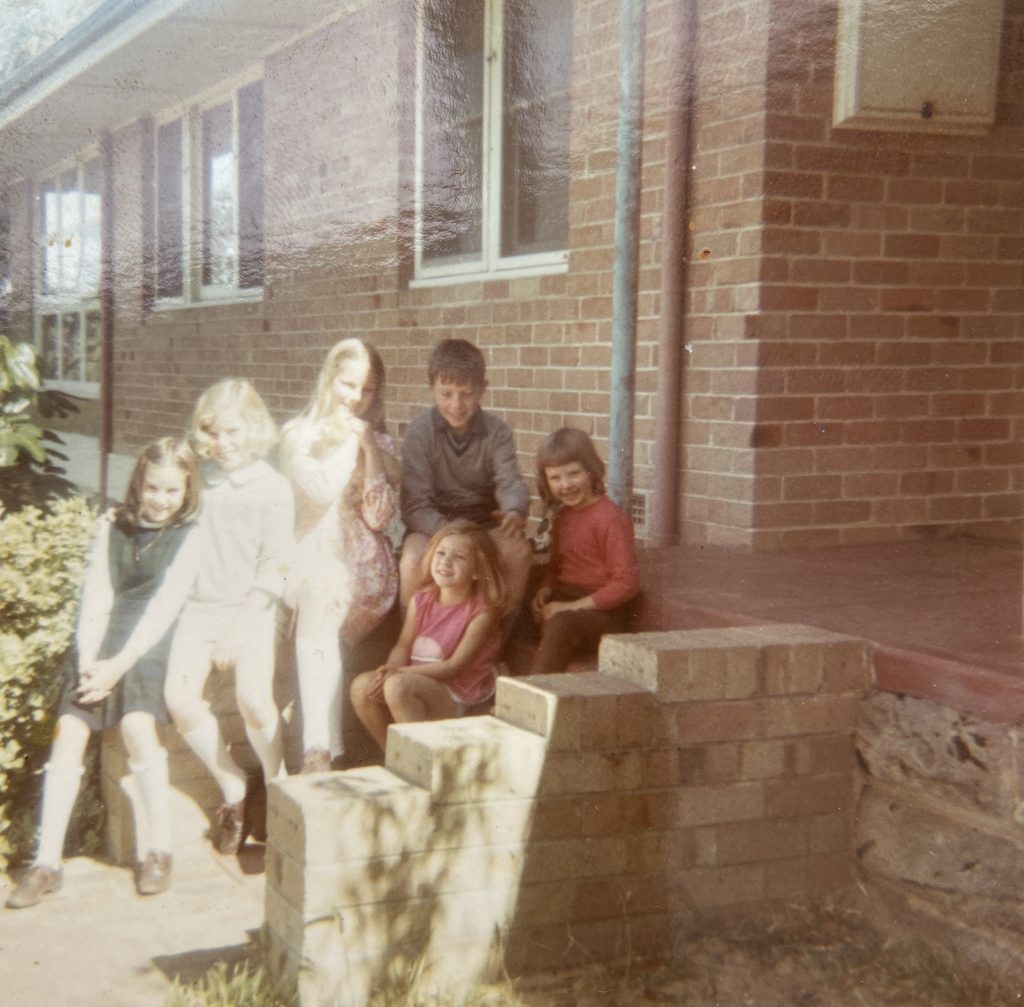 A picture of six children sitting on the steps of a house in Scarborough, Perth 1969. I am in the centre. It's described in full in the blog.